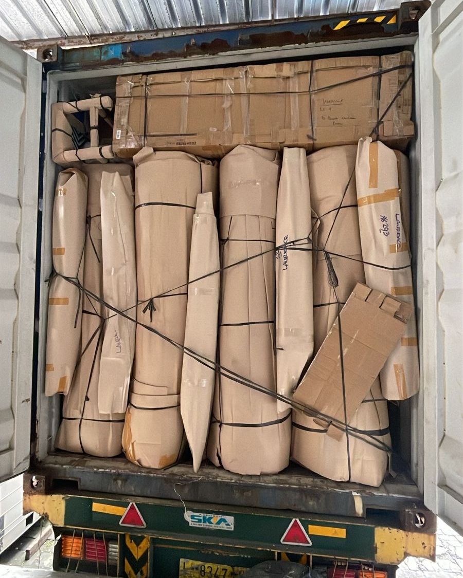 Truck loaded with wrapped furniture