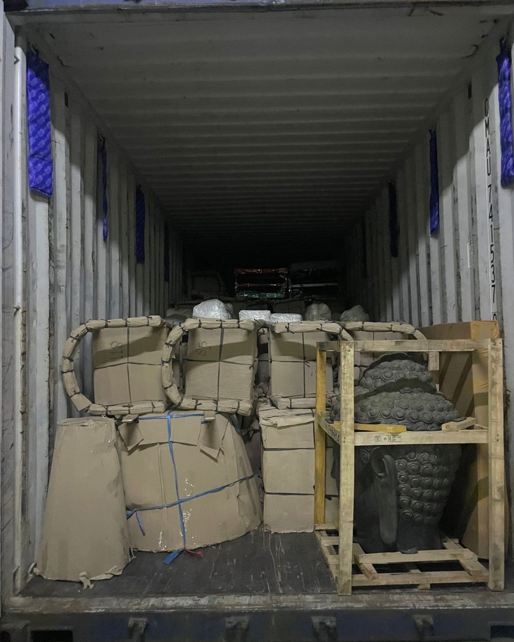 Container loaded with crates from several shippers