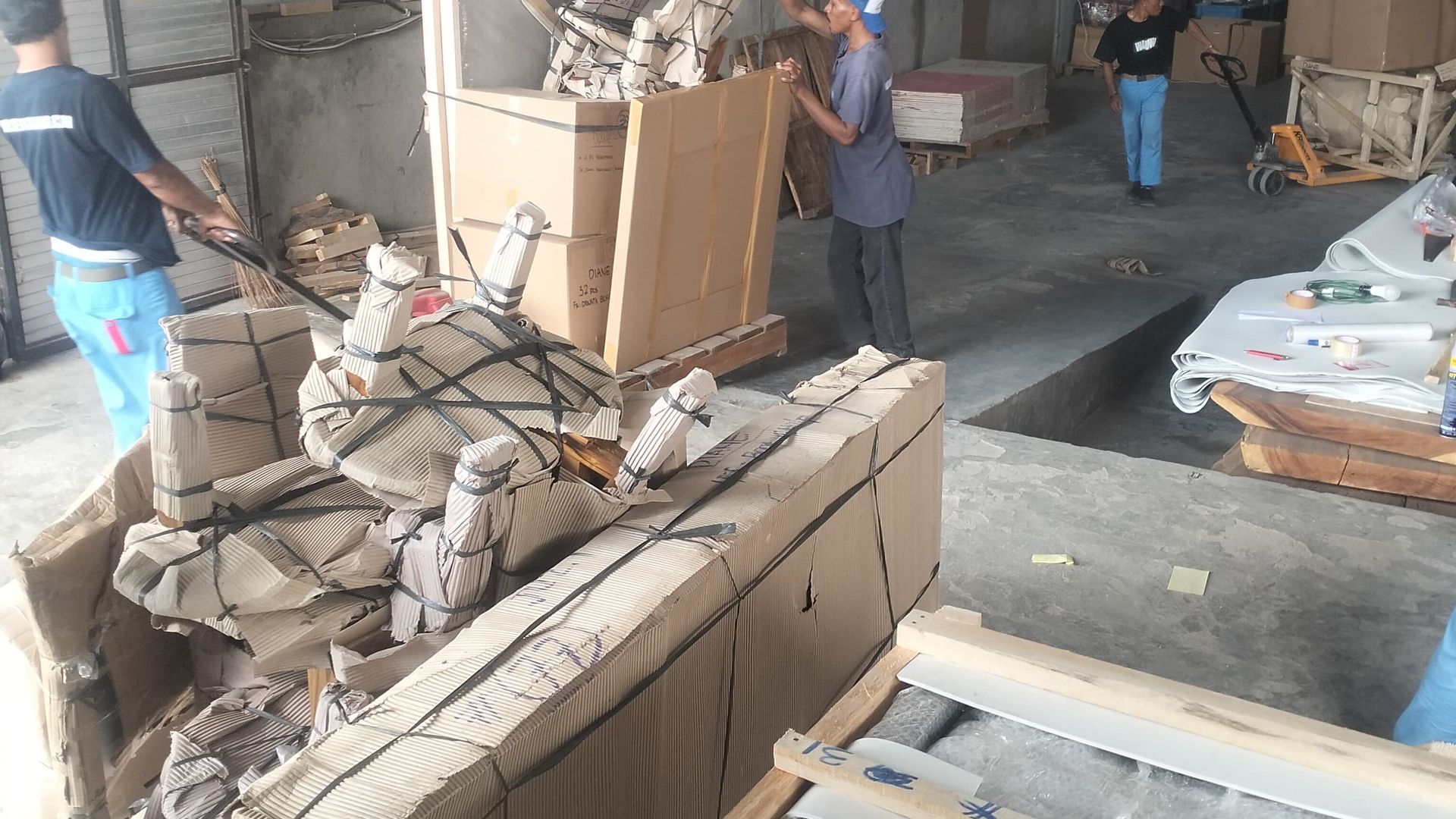 Packing furniture in the Bali Pro Cargo warehouse
