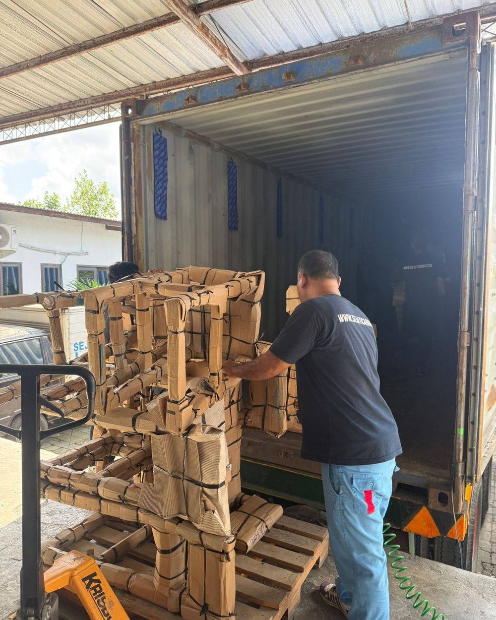 Pallet of crates loaded towards a truck